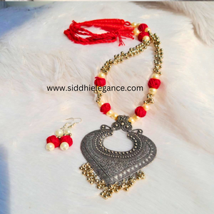 Oxidised pendant red cotton bead necklace